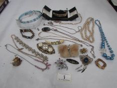 A mixed lot of costume jewellery including necklaces,