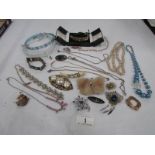 A mixed lot of costume jewellery including necklaces,