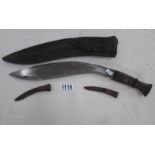 A Kukri in sheath and complete with skinning knives