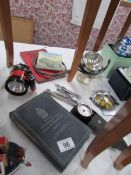 An AA badge and other motoring items