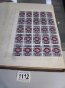 An album of GB stamps including mint full sheets