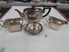 A 3 piece silver plate tea set and a wine coaster