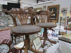 A pair of 1930's rotating desk chairs