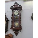 A Victorian mahogany twin weight Vienna wall clock