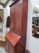 A Victorian mahogany bureau book case