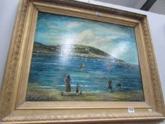 A gilt framed oil on canvas beach scene signed S Bonney