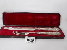 A cased silver cake knife and fork, maker A H.