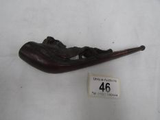 A Black Forest pipe with dog ornamentation