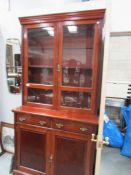 A mahogany glazed book case