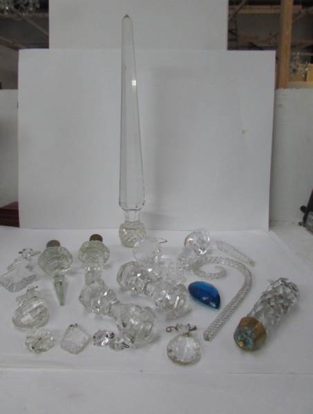 A mixed lot of glass stoppers, knife rests,