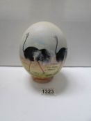 A hand painted ostrich egg