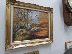 An oil on canvas autumn woodland walk signed Bill Makinson