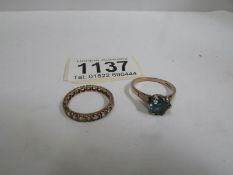 A 9ct yellow gold eternity ring size M and a 9ct gold topaz ring size O