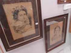 A pair of oak framed portraits of ladies