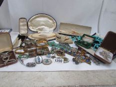 A mixed lot of vintage jewellery including necklaces, brooches,
