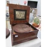 A Victorian table polyphon with several discs