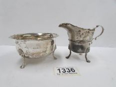 A silver cream jug and sugar bowl,