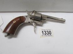 An early 20th century cigar cutter in the form of a pistol