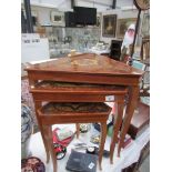 A nest of 3 triangular shaped inlaid tables