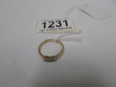 An 18ct gold ring set 3 diamonds, (3gms)