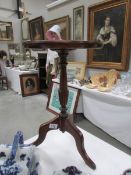 A mahogany wine table with Tudor rose carving