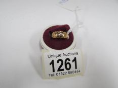 A Victorian gypsy set diamond three stone ring in 18ct gold, (2gms)