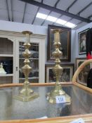 A pair of brass candlesticks