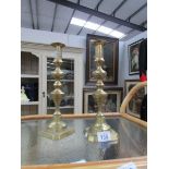 A pair of brass candlesticks