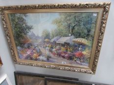 A framed and glazed print of a flower market