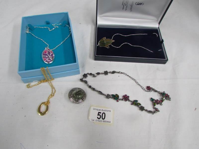 5 items of costume jewellery including silver spirits necklace and indulge necklace