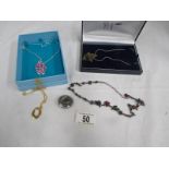 5 items of costume jewellery including silver spirits necklace and indulge necklace