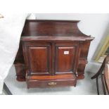 A mahogany wall cabinet