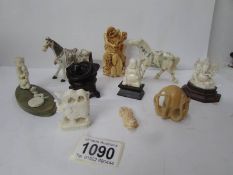 A mixed lot of oriental figures including horses,