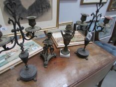 A pair of candelabra and 2 other candlesticks