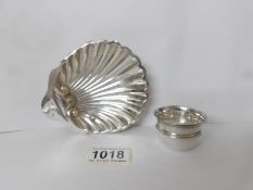 A silver scallop shaped dish, Birmingham 1943, 43 gms and a small silver pot, Birmingham 1913,