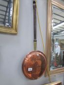 A copper warming pan