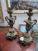 A pair of ornate candlesticks