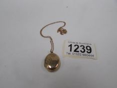 A 9ct gold back and front locket on a 9ct gold chain