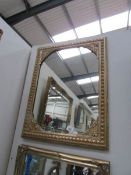 A gilt framed mirror