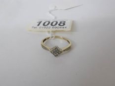 A 9ct yellow gold quarter carat diamond ring in the shape of a diamond,