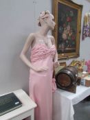 A mannequin in pink gown