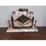 An art deco onyx/marble mantel clock