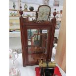 A small astragal glazed cabinet with bevelled mirror back