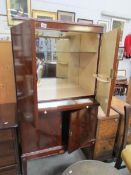 A good mahogany drinks cabinet with pull out slide
