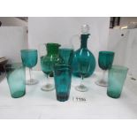 A green glass decanter,
