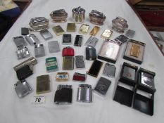 Approximately 40 cigarette lighters including Zippo