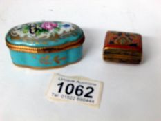 A porcelain pill box and one other