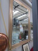 A gilt framed bevel edged mirror