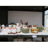 A shelf of miscellaneous including butter dishes etc