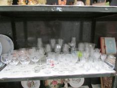 A shelf of drinking glasses
